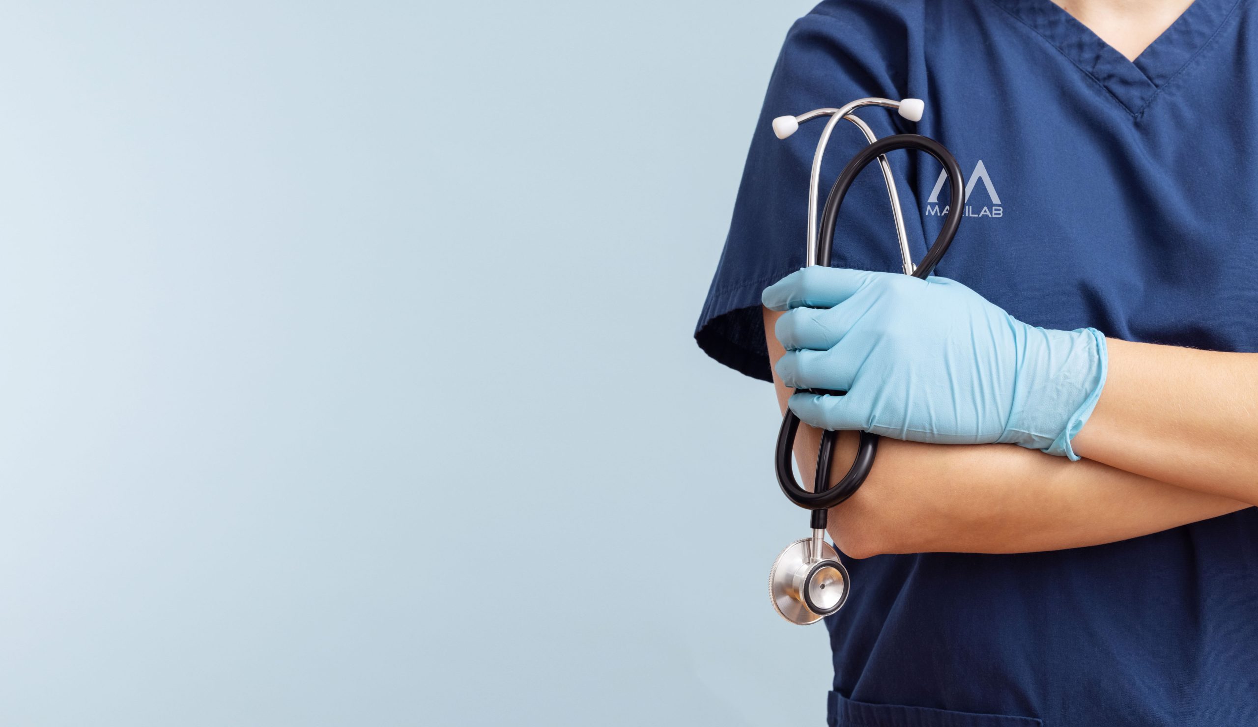 Female doctor in uniform with stethoscope on a blue background